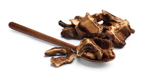 Photo of Pieces of dried mushrooms and spoon isolated on white