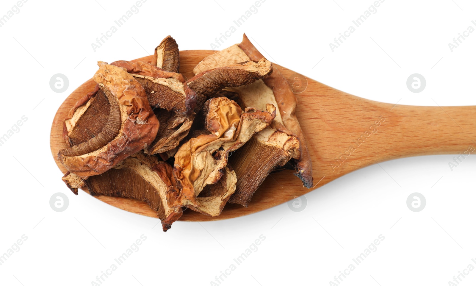 Photo of Pieces of dried mushrooms and spoon isolated on white, top view