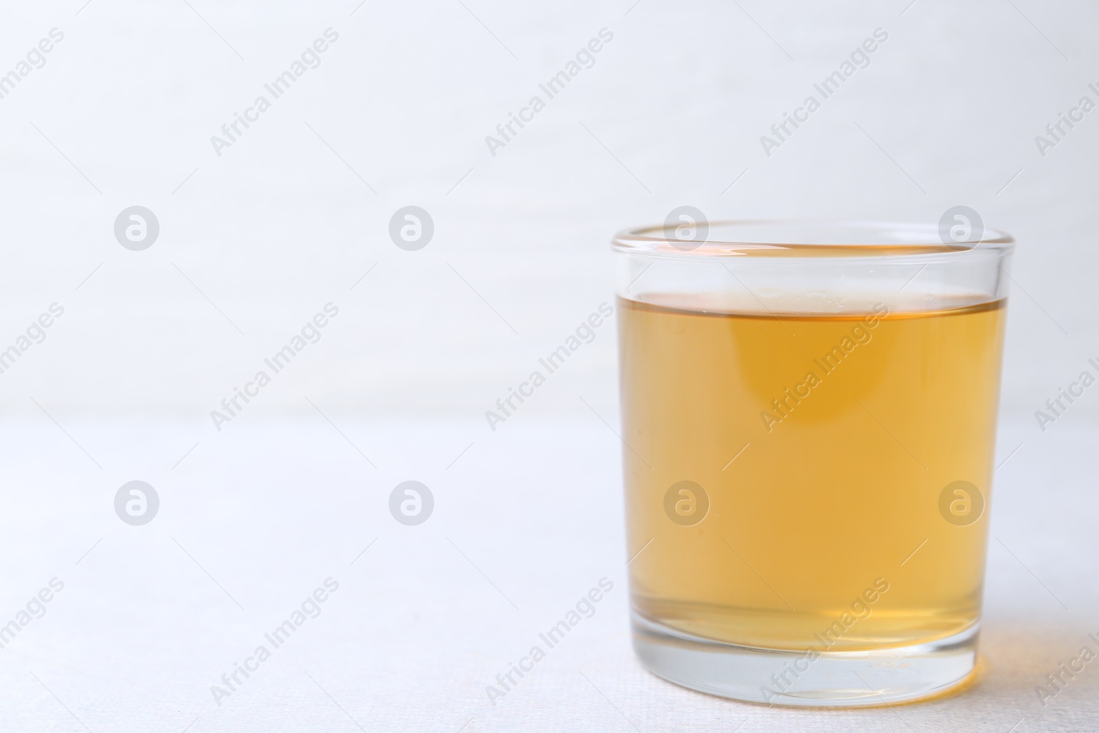 Glass with dirty water on light table, closeup. Space for text Photo of Glass with dirty water on light table, closeup. Space for text