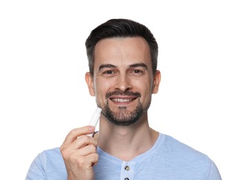 Photo of Smiling man with lip balm on white background