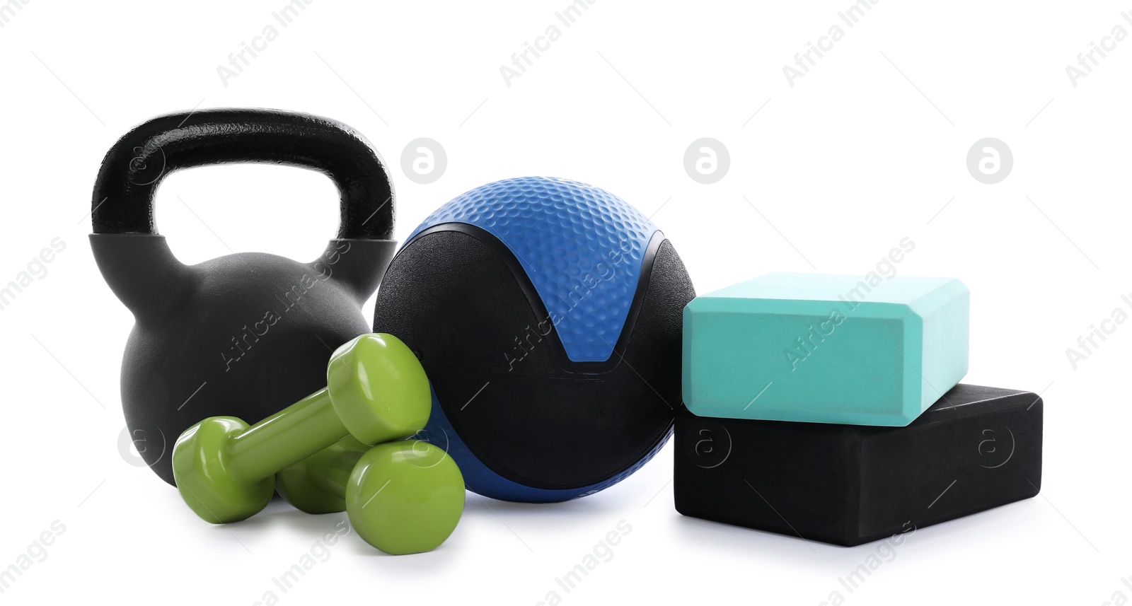 Medicine ball, kettlebell, dumbbells and foam blocks isolated on white Photo of Medicine ball, kettlebell, dumbbells and foam blocks isolated on white