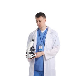 Photo of Medical student with microscope on white background