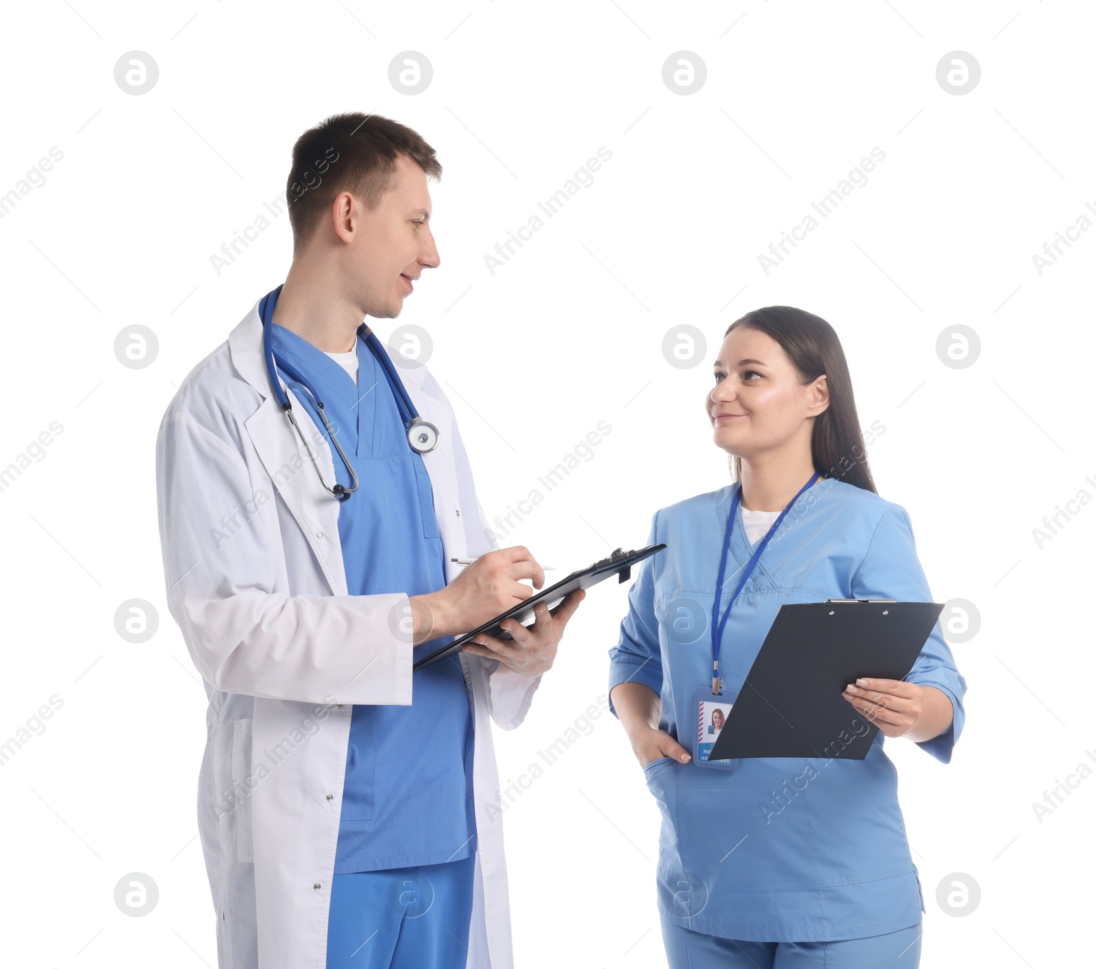 Photo of Medical students with clipboards on white background