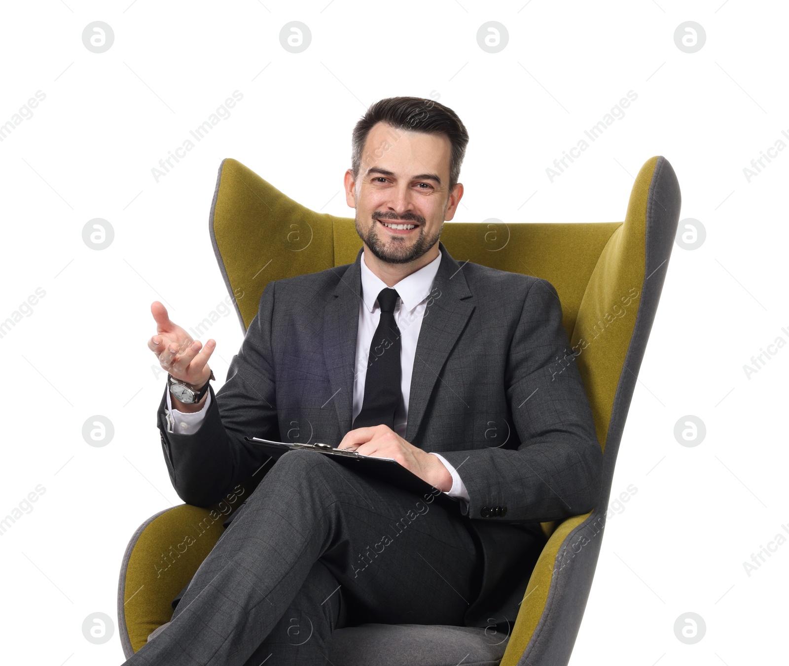 Professional psychologist with clipboard in armchair on white background Photo of Professional psychologist with clipboard in armchair on white background