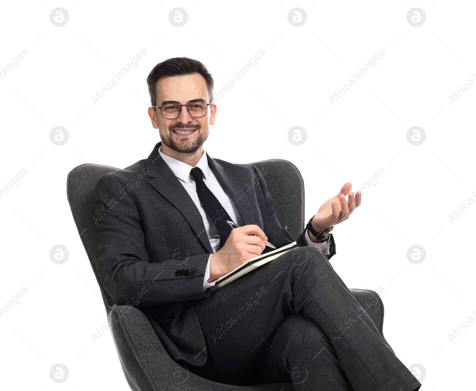Professional psychologist with notebook in armchair on white background Photo of Professional psychologist with notebook in armchair on white background