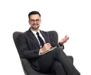 Photo of Professional psychologist with notebook in armchair on white background