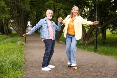 Photo of Lovely senior couple having fun together in park