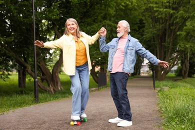Photo of Lovely senior couple having fun together in park