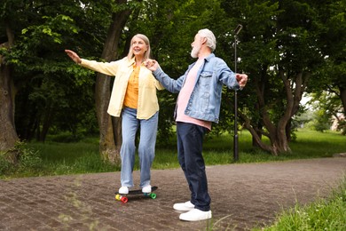 Photo of Lovely senior couple having fun together in park