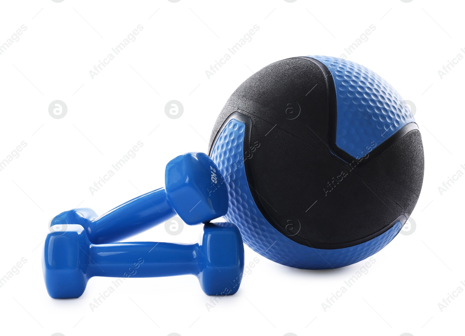 Medicine ball and dumbbells isolated on white Photo of Medicine ball and dumbbells isolated on white