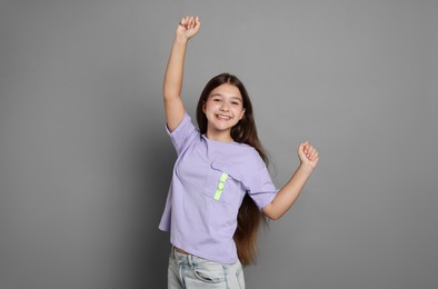Photo of Portrait of teenage girl on grey background