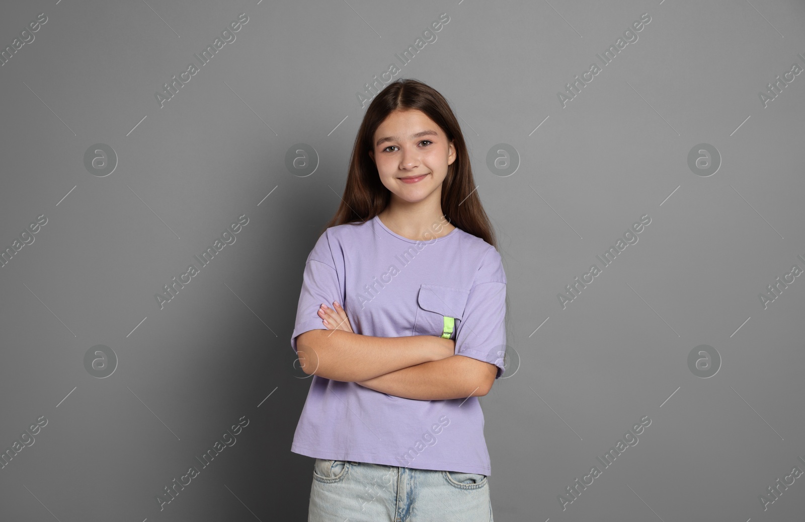 Photo of Portrait of teenage girl on grey background