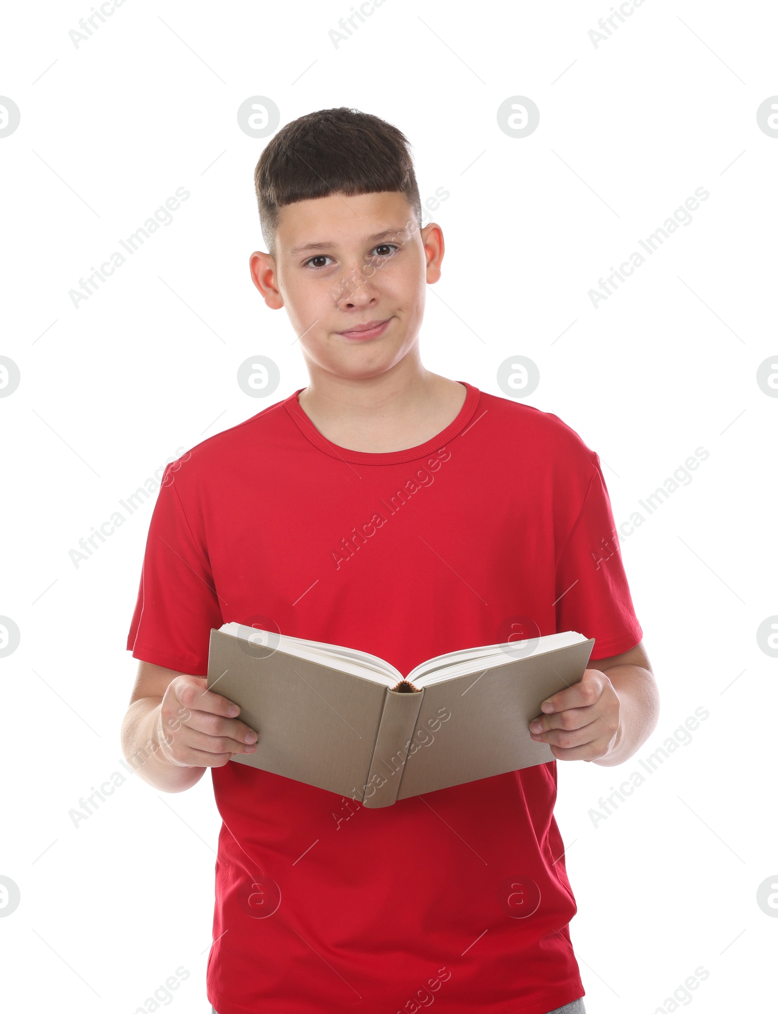 Teenage boy reading book on white background Photo of Teenage boy reading book on white background