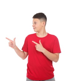 Photo of Teenage boy pointing at something on white background