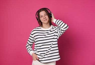Photo of Teenage girl in headphones on crimson background