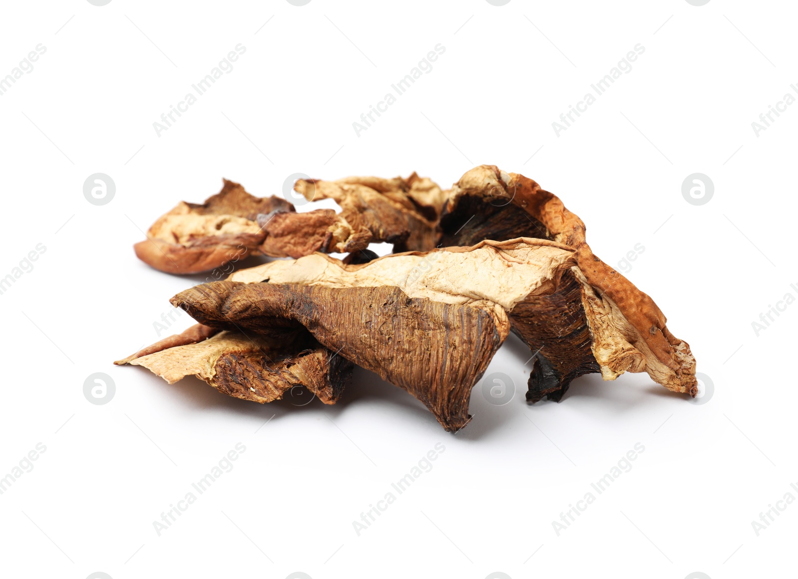 Photo of Pieces of dried mushrooms isolated on white