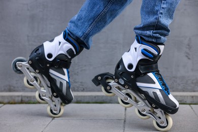 Photo of Man roller skating on city street, closeup