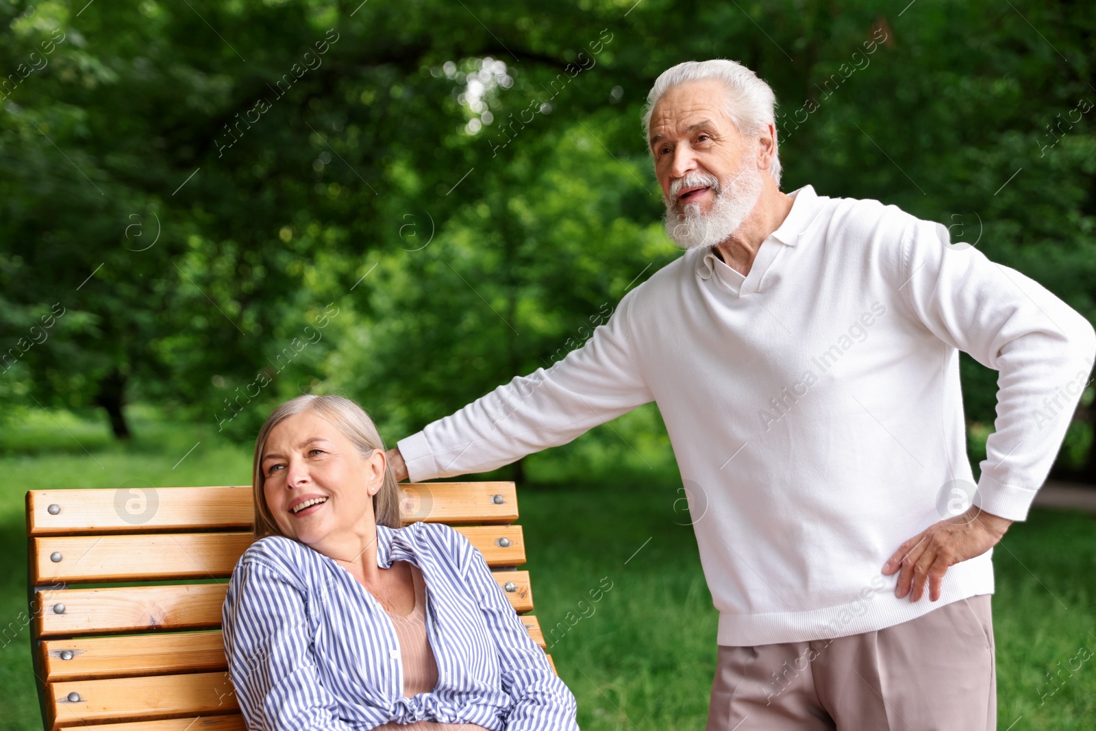 Photo of Lovely senior couple spending time together in park