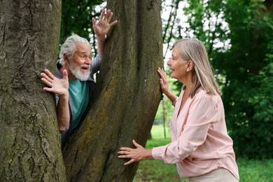 Photo of Lovely senior couple near tree in park