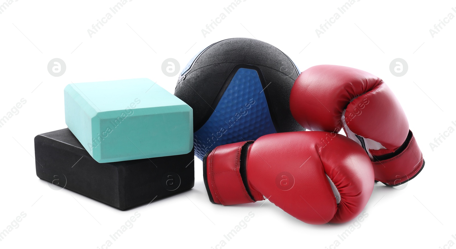 Photo of Medicine ball, boxing gloves and foam blocks isolated on white