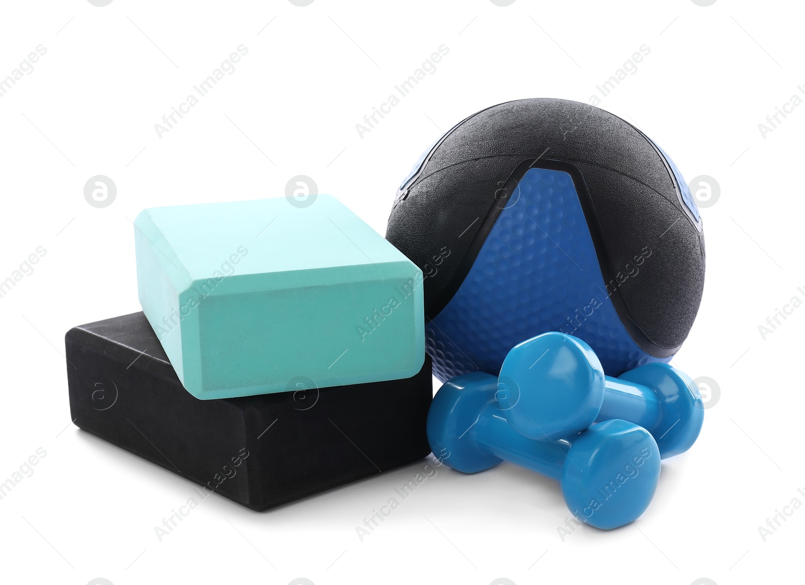 Medicine ball, dumbbells and foam blocks isolated on white Photo of Medicine ball, dumbbells and foam blocks isolated on white
