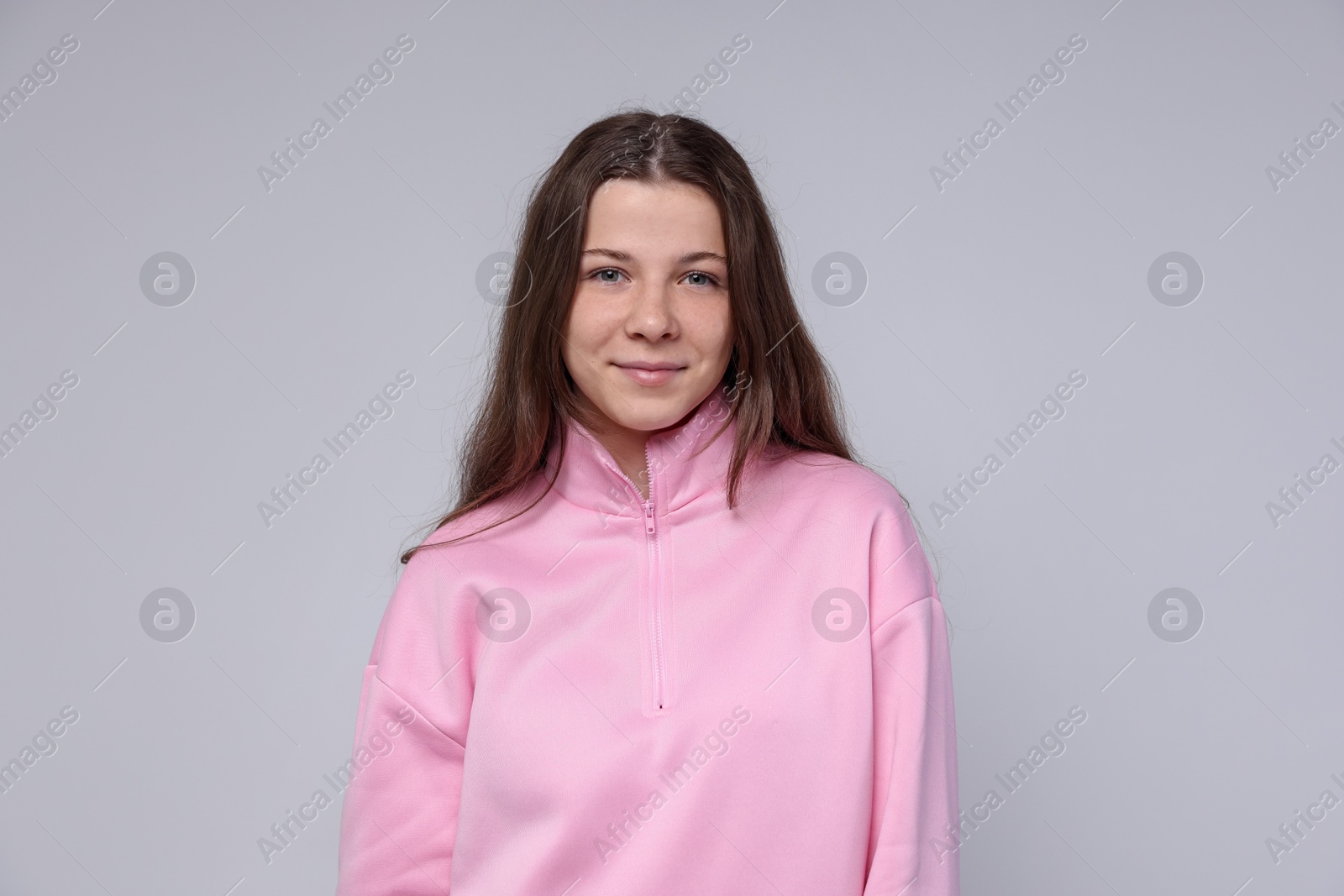 Photo of Portrait of teenage girl on light grey background