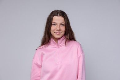 Photo of Portrait of teenage girl on light grey background