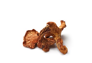 Photo of Many dried chanterelle mushrooms isolated on white