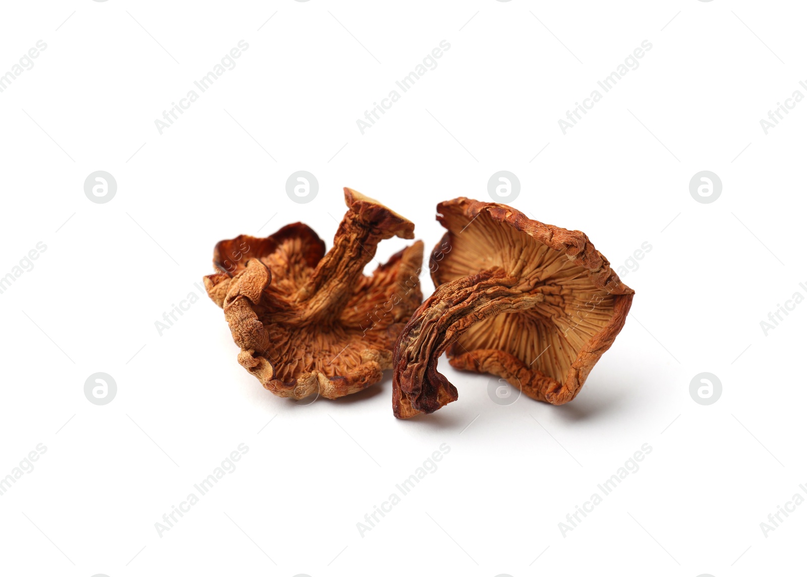 Photo of Many dried chanterelle mushrooms isolated on white