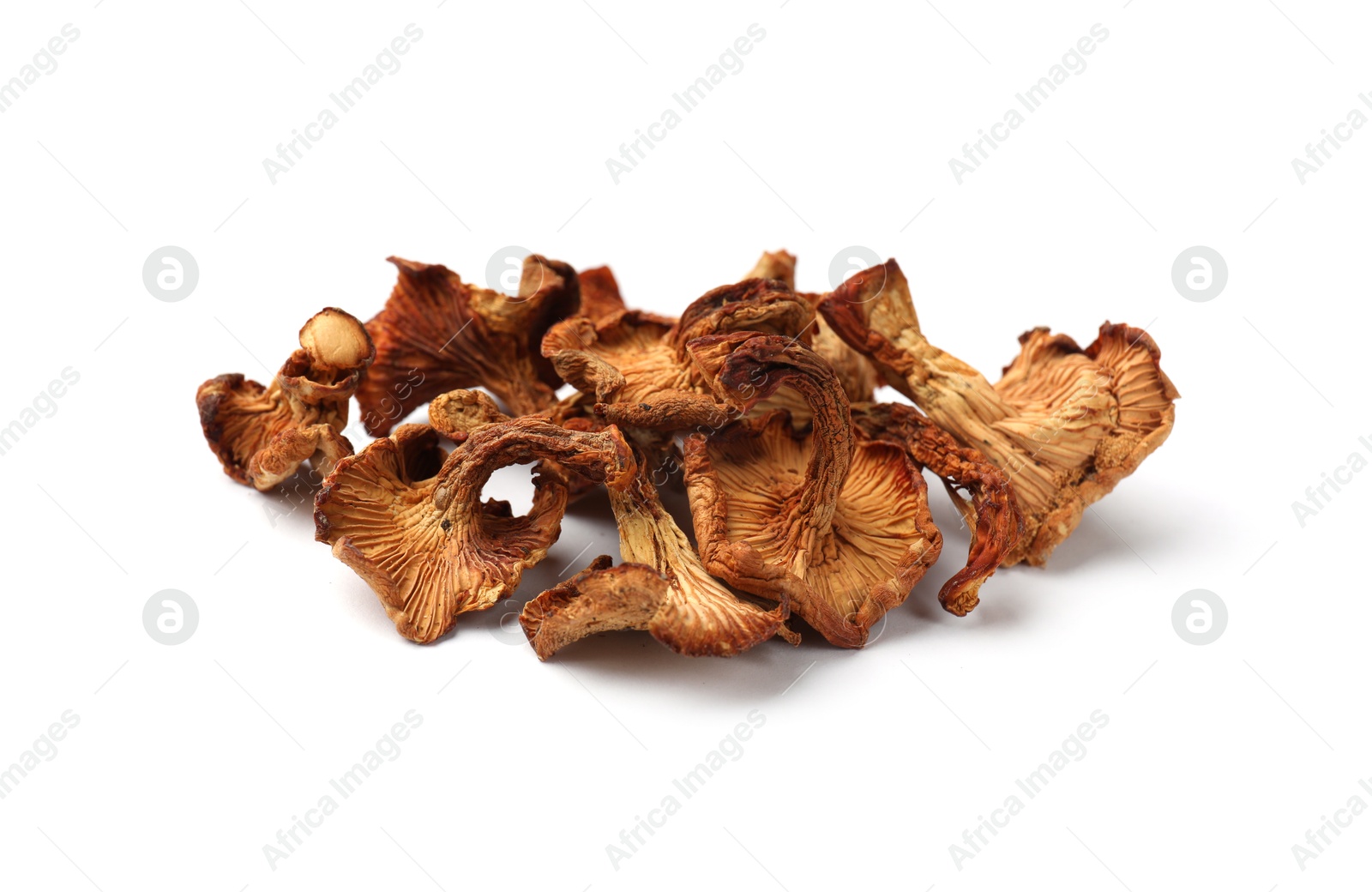 Photo of Many dried chanterelle mushrooms isolated on white