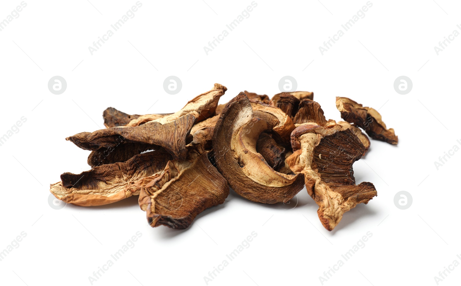 Pieces of dried mushrooms isolated on white Photo of Pieces of dried mushrooms isolated on white