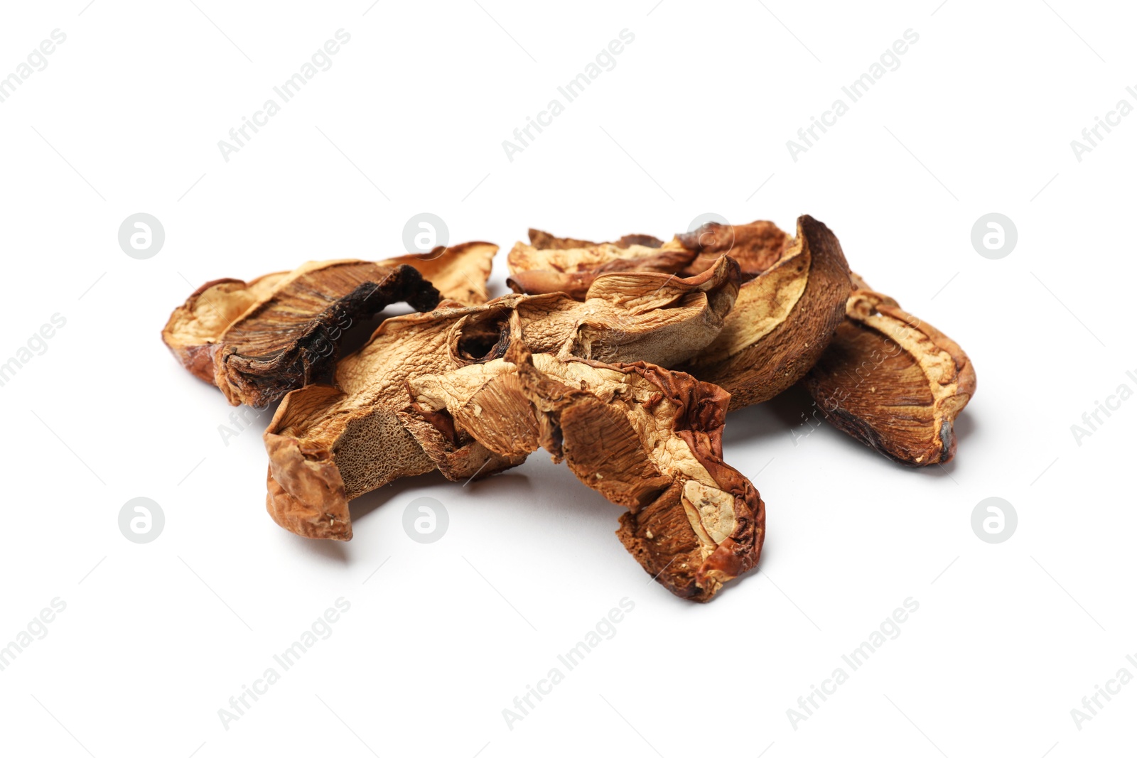 Photo of Pieces of dried mushrooms isolated on white