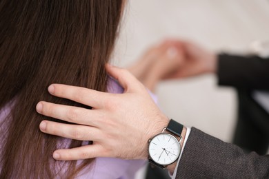 Photo of Psychologist supporting patient during therapy session in office, closeup