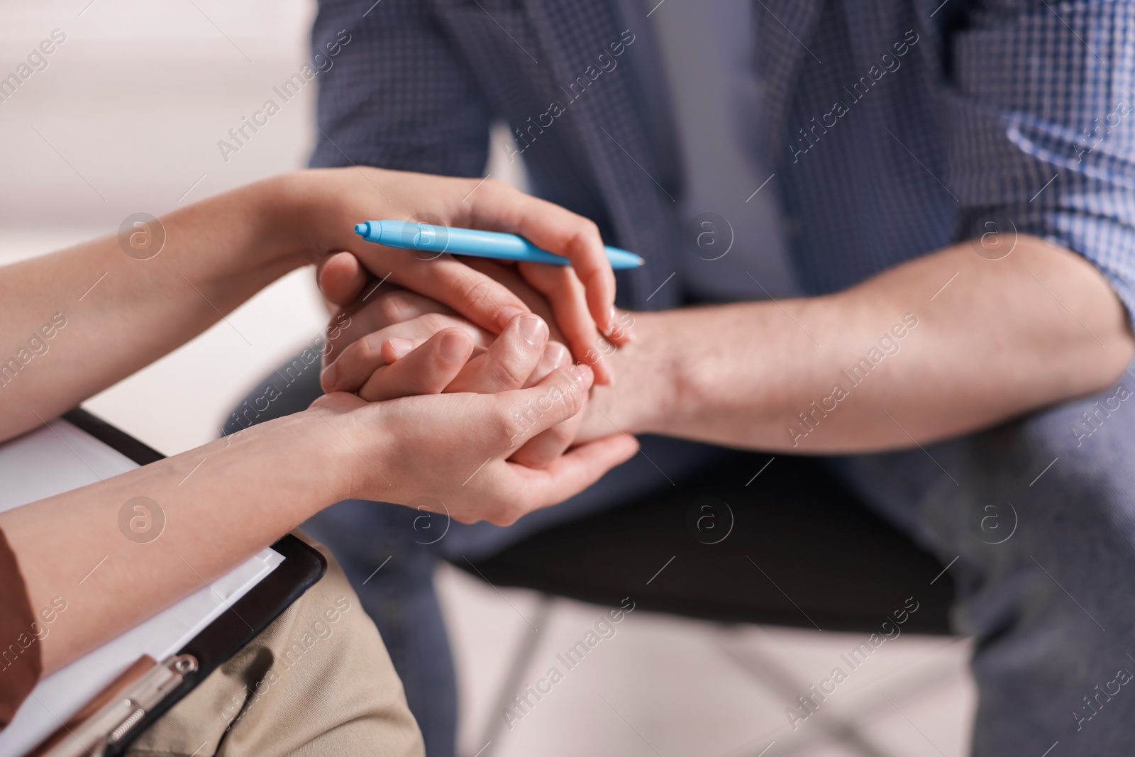 Psychologist supporting patient during therapy session in office, closeup Photo of Psychologist supporting patient during therapy session in office, closeup
