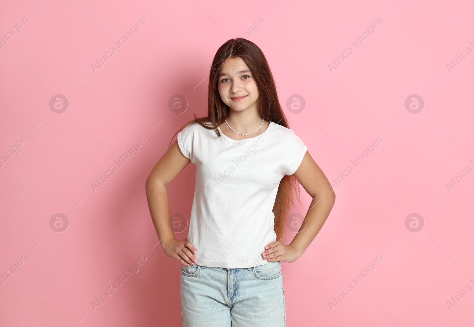 Portrait of teenage girl on pink background Photo of Portrait of teenage girl on pink background