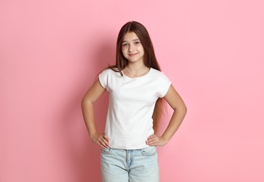 Photo of Portrait of teenage girl on pink background