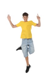 Photo of Portrait of teenage boy jumping on white background