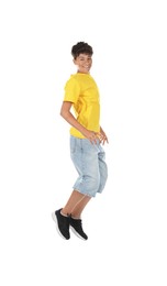 Photo of Portrait of teenage boy jumping on white background