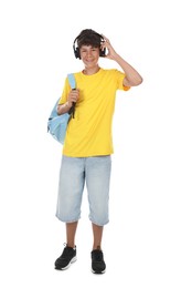 Photo of Teenage boy in headphones with backpack on white background
