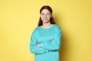 Photo of Portrait of teenage girl on yellow background