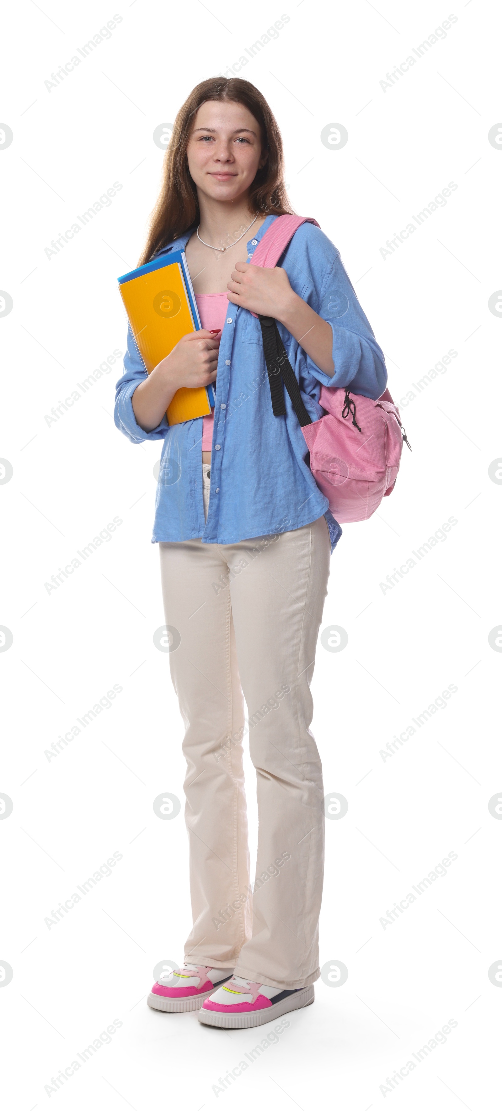 Photo of Teenage girl with backpack and notebooks on white background