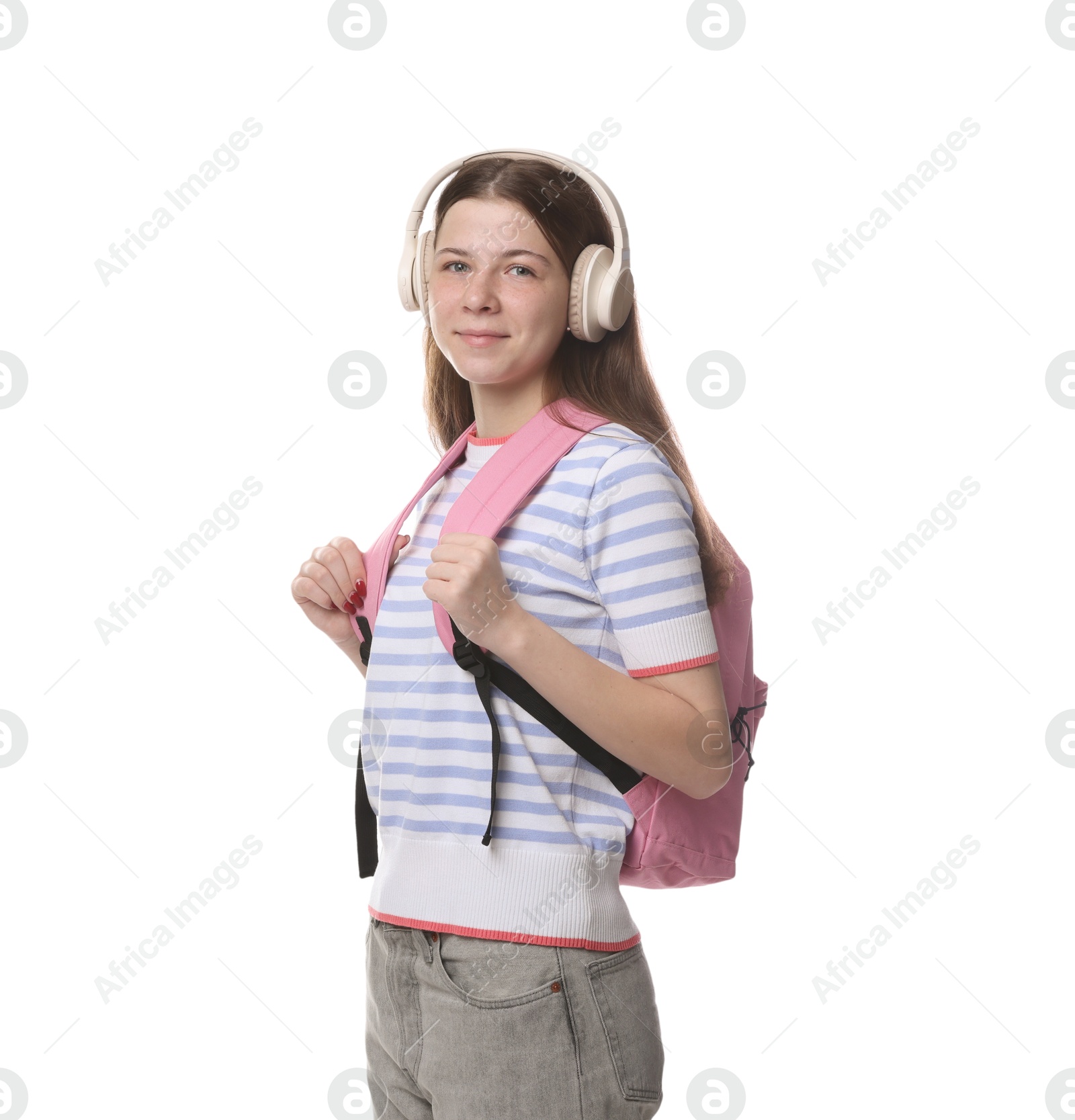 Teenage girl in headphones with backpack on white background Photo of Teenage girl in headphones with backpack on white background