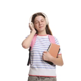 Photo of Teenage girl in headphones with backpack and notebooks on white background