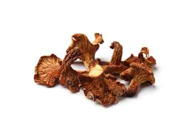 Photo of Many dried chanterelle mushrooms isolated on white