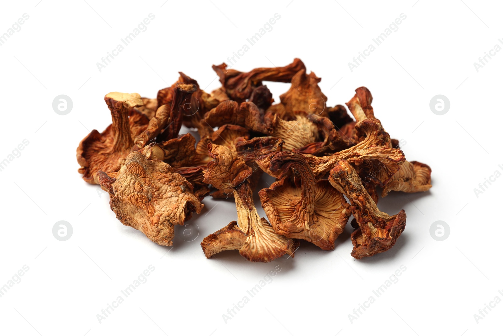Many dried chanterelle mushrooms isolated on white Photo of Many dried chanterelle mushrooms isolated on white