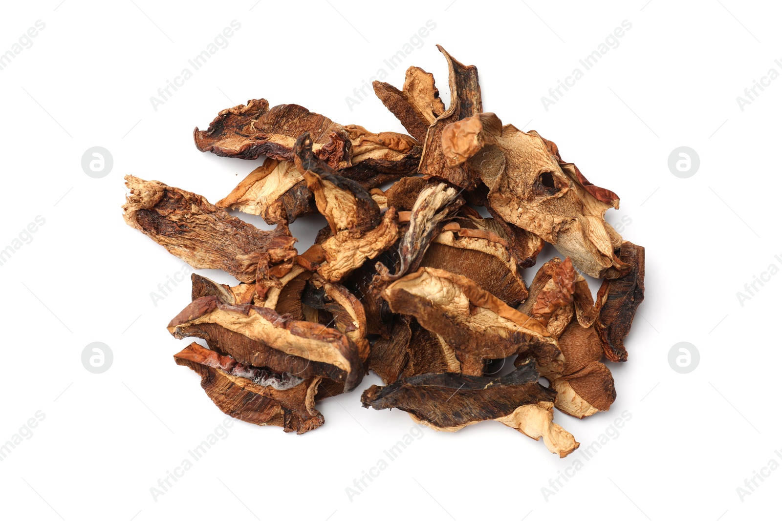 Photo of Pieces of dried mushrooms isolated on white, top view