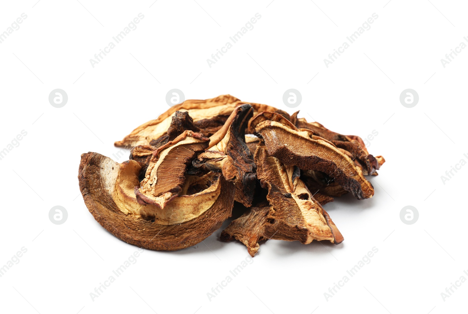 Pieces of dried mushrooms isolated on white Photo of Pieces of dried mushrooms isolated on white