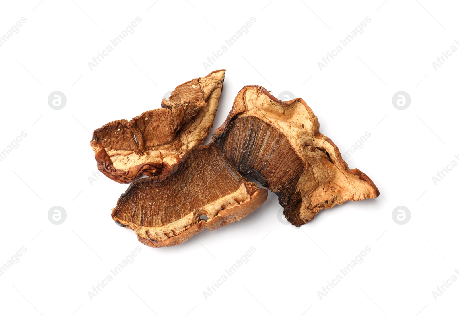 Photo of Pieces of dried mushrooms isolated on white, top view