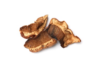 Photo of Pieces of dried mushrooms isolated on white, top view