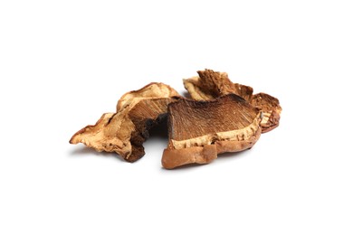 Photo of Pieces of dried mushrooms isolated on white